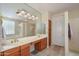 Bathroom featuring dual sinks, soaking tub, and a walk-in shower at 19541 N Rim Dr, Surprise, AZ 85374