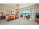 Bright bedroom showcases two beds and a window with golf course views at 19541 N Rim Dr, Surprise, AZ 85374