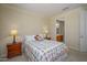 Comfortable bedroom with nightstands, lamps, and a view to the connected bathroom at 19541 N Rim Dr, Surprise, AZ 85374