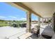 Relaxing covered patio overlooking a golf course with outdoor seating and beautiful landscaping at 19541 N Rim Dr, Surprise, AZ 85374