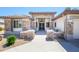Attractive home with meticulous stone landscaping, complemented by modern exterior and attached two-car garage at 19541 N Rim Dr, Surprise, AZ 85374
