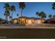 Charming property with lush landscaping and inviting curb appeal in a desirable neighborhood at 19541 N Rim Dr, Surprise, AZ 85374