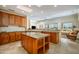 Kitchen with ample cabinet space, island, and views to the exterior at 19541 N Rim Dr, Surprise, AZ 85374