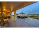 Outdoor patio with comfortable seating area overlooking the golf course at 19541 N Rim Dr, Surprise, AZ 85374