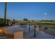 Patio area with seating offers views of the golf course and desert landscaping at 19541 N Rim Dr, Surprise, AZ 85374