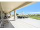 Covered patio providing shade and comfort, overlooking a beautifully landscaped golf course, ideal for outdoor relaxation at 19541 N Rim Dr, Surprise, AZ 85374