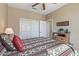 Cozy bedroom with a patterned bedspread and closet, offering ample storage space at 20307 N Painted Sky Dr, Surprise, AZ 85374