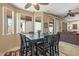 Bright dining area with large windows and a modern ceiling fan at 20307 N Painted Sky Dr, Surprise, AZ 85374