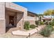 Inviting front entrance with a security door, well-kept landscape, and a brick-lined walkway at 20307 N Painted Sky Dr, Surprise, AZ 85374