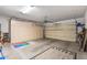 Spacious garage with built-in cabinets and an automatic door opener at 20307 N Painted Sky Dr, Surprise, AZ 85374