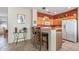 Bright kitchen with granite countertops, stainless steel appliances and a breakfast bar at 20307 N Painted Sky Dr, Surprise, AZ 85374