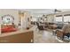 Open-concept living spaces with tile flooring and neutral color palette at 20307 N Painted Sky Dr, Surprise, AZ 85374