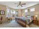 Spacious main bedroom with a bay window providing ample natural light and backyard views at 20307 N Painted Sky Dr, Surprise, AZ 85374