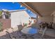 Spacious covered patio with dining, garden, and a peaceful outdoor atmosphere at 20307 N Painted Sky Dr, Surprise, AZ 85374