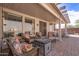 Inviting outdoor patio featuring comfortable seating around a fire pit for relaxed gatherings at 20307 N Painted Sky Dr, Surprise, AZ 85374