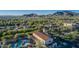 Expansive aerial view showcasing community center, pool, landscaping, and the surrounding desert landscape at 20607 W Point Ridge Rd, Buckeye, AZ 85396
