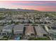 Beautiful sunset over a neighborhood in the mountains at 20607 W Point Ridge Rd, Buckeye, AZ 85396