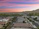 An aerial view of a Primary-planned community showcasing the neighborhood's layout, and surrounding environment at 20607 W Point Ridge Rd, Buckeye, AZ 85396