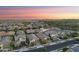 Wide aerial showcases a neighborhood with a nice layout, various home styles, and easy access to the main street at 20607 W Point Ridge Rd, Buckeye, AZ 85396