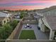 An aerial view of a landscaped backyard featuring a seating area, artificial turf, and privacy walls at 20607 W Point Ridge Rd, Buckeye, AZ 85396