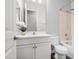 This bathroom features white cabinets, a toilet, and a shower at 20607 W Point Ridge Rd, Buckeye, AZ 85396