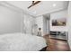 Bright bedroom with a TV, ceiling fan and mirror at 20607 W Point Ridge Rd, Buckeye, AZ 85396