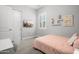 This bedroom has a desk, closet, TV, and a window with white panes at 20607 W Point Ridge Rd, Buckeye, AZ 85396