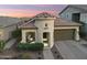 A charming turret entry highlights this home with low maintenance desert landscaping at 20607 W Point Ridge Rd, Buckeye, AZ 85396