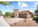 Beautiful home featuring desert landscaping, a circular tower entrance, and a spacious two-car garage at 20607 W Point Ridge Rd, Buckeye, AZ 85396