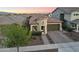 This is an exterior aerial view of a beige single-Gathering home with a tile roof at 20607 W Point Ridge Rd, Buckeye, AZ 85396