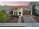 This is an exterior aerial view of a beige single-Gathering home with a tile roof at 20607 W Point Ridge Rd, Buckeye, AZ 85396