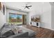 Comfortable living room with a large sectional sofa and sliding glass doors to the backyard at 20607 W Point Ridge Rd, Buckeye, AZ 85396