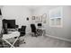 This office has gray walls, carpet, and two desks with black office chairs at 20607 W Point Ridge Rd, Buckeye, AZ 85396