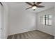 Bright bedroom with a ceiling fan, carpeted floors, and a window at 2315 N 52Nd St # 102, Phoenix, AZ 85008