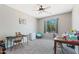 Bedroom with carpeted floors, neutral walls, a window view, and a ceiling fan at 23955 W La Salle St, Buckeye, AZ 85326