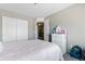 Comfortable bedroom with a large closet and a view of the hallway at 23955 W La Salle St, Buckeye, AZ 85326