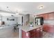 Island kitchen adjacent to the stairway and living room at 23955 W La Salle St, Buckeye, AZ 85326