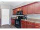 Kitchen featuring wooden cabinets and countertops with modern appliances at 23955 W La Salle St, Buckeye, AZ 85326