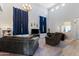 Large living room featuring high ceilings, comfortable couches, carpet, and laminate flooring at 23955 W La Salle St, Buckeye, AZ 85326