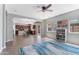 Spacious living room features wood-look floors and open access to the kitchen at 23955 W La Salle St, Buckeye, AZ 85326