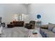 Inviting living room with neutral walls, comfortable seating, and carpeted flooring at 23955 W La Salle St, Buckeye, AZ 85326