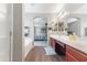 The main bathroom offers double vanity, bathtub, and access to the main bedroom at 23955 W La Salle St, Buckeye, AZ 85326