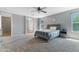 Large main bedroom with plush carpet and bathroom access offers comfort and style at 23955 W La Salle St, Buckeye, AZ 85326