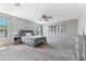 Spacious main bedroom with plush carpet, ceiling fan, and generous natural light at 23955 W La Salle St, Buckeye, AZ 85326