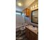 Bathroom showcasing tub/shower combination, wood-look floors, and vanity at 2400 E Baseline Ave # 144, Apache Junction, AZ 85119