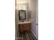 Cozy bathroom boasting wood-look floors, vanity with a mirror, and neutral paint at 2400 E Baseline Ave # 144, Apache Junction, AZ 85119