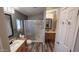Well-lit bathroom equipped with a glass-enclosed shower and double vanity at 2400 E Baseline Ave # 144, Apache Junction, AZ 85119