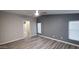 Bedroom with new floors, neutral paint, and ample sunlight from the two windows at 2400 E Baseline Ave # 144, Apache Junction, AZ 85119