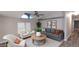 Bright living room featuring modern furnishings, vaulted ceiling, and large windows at 2400 E Baseline Ave # 144, Apache Junction, AZ 85119