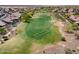 Scenic aerial view of a lush golf course surrounded by homes in a vibrant community at 26725 W Marco Polo Rd, Buckeye, AZ 85396